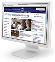 A computer monitor displays the Veterans Health Library website.