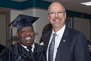 Keith Kirkland, a graduate from the School at Work program, and Michael Moreland, VISN 4 director.