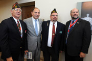Veterans of Foreign Wars members Peter Cook and Ricky Snyder meet Secretary of Veterans Affairs Robert A. McDonald.