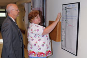 Michael E. Moreland talks with Erie VAMC Nurse Mary Lanphere about PACT implementation at Erie.