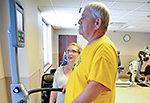 Army Veteran Harry Alton Spiker walks on a treadmill under the watchful eye of VA Butler Healthcare Kinesiotherapist Marcy Huey.
