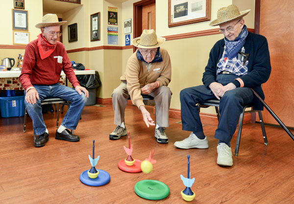 A group of Veterans play a game designed to increase spatial awareness and hand-eye coordination.