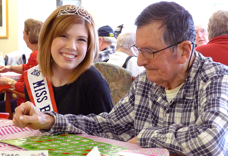 Kayla Gallagher, 2015 Miss Butler County USA, visits with Veterans during a lunch date at VA Butler Healthcare's Adult Day Health Care.