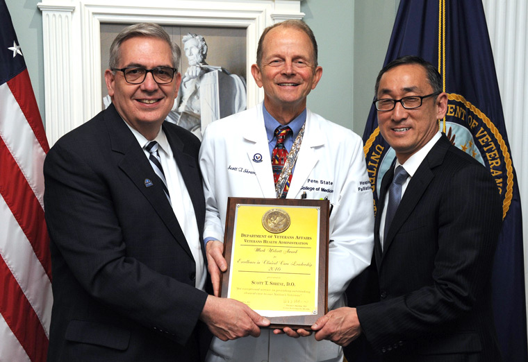 Dr. Scott T. Shreve (center) is presented with the 2016 Mark Wolcott Award for Excellence in Clinical Leadership.