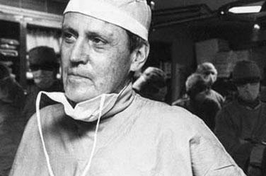 Dr. Starzl dressed in scrubs in the operating room following a transplant.