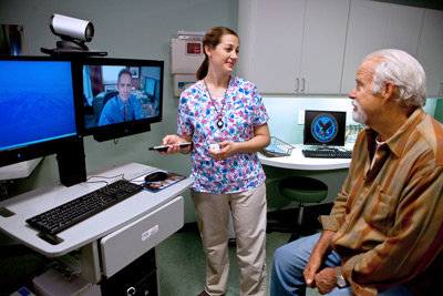A Veteran meets with a provider via telehealth during a clinic visit.