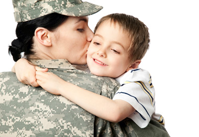 A female servicemember hugging her son.
