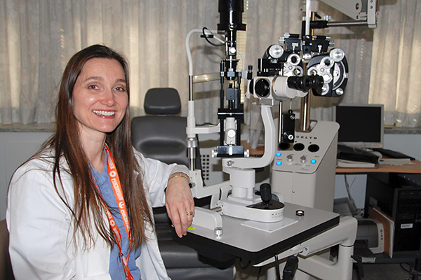 A clinician in the eye clinic exam room.