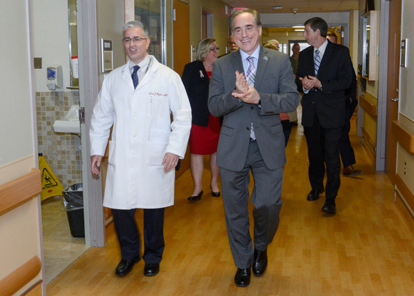 Dr. David Shulkin walking on a tour of the medical center.